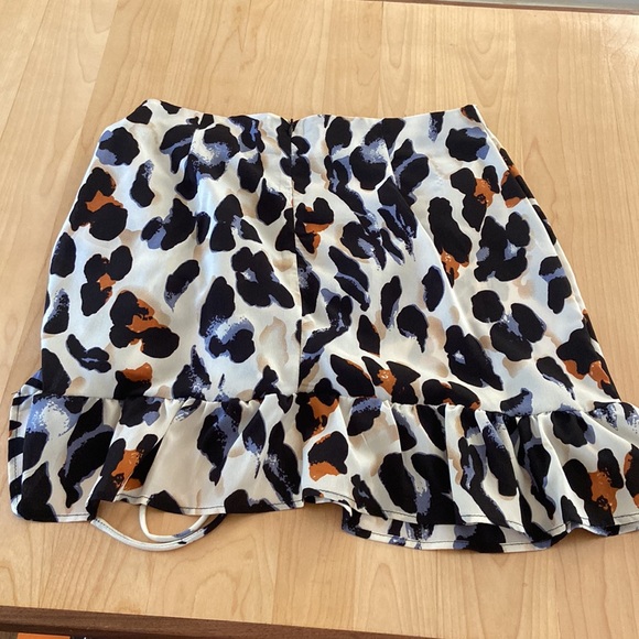 Cheeta print skirt, worn once. Blue, black, brown, and cream. Good condition. - Picture 4 of 10